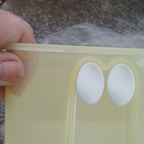 Tupperware set of 2 with eye holes, new