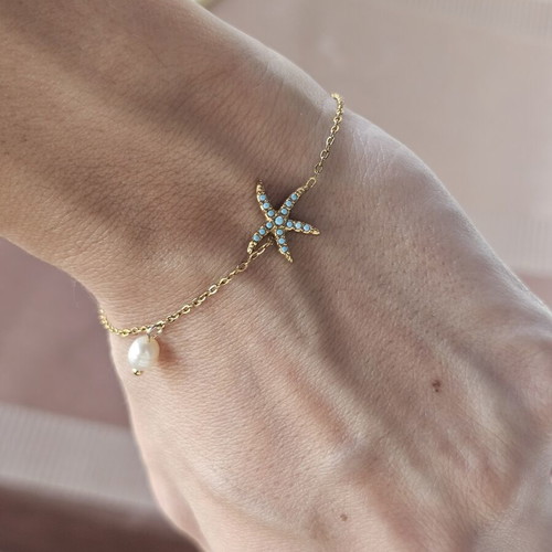 Steel bracelet with gold tone, blue star and pearl