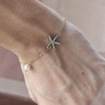 Steel bracelet with gold tone, blue star and pearl