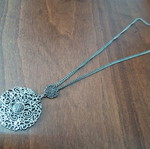 Metal pendant with pierced design used, silver color