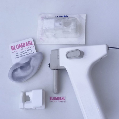 Nose Piercing Gun system like new with 27 nose earrings and tester