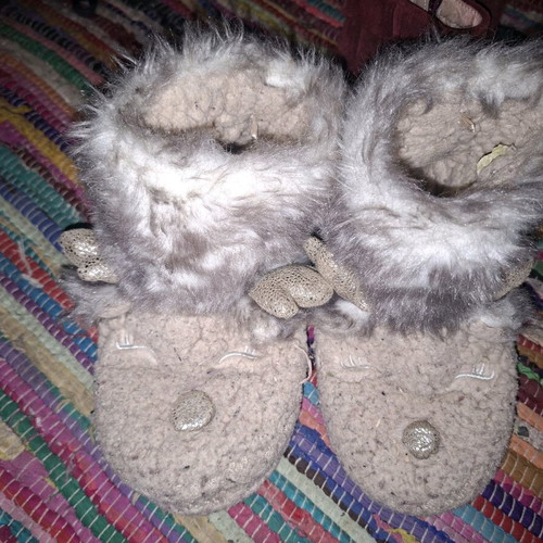 Children's fuzzy reindeer slippers used with glitter details