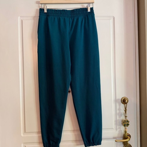 Under Armour green sweatpants with white drawstrings like new