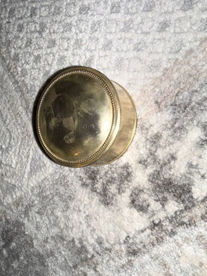 Small silver metal jewelry box used with velour interior