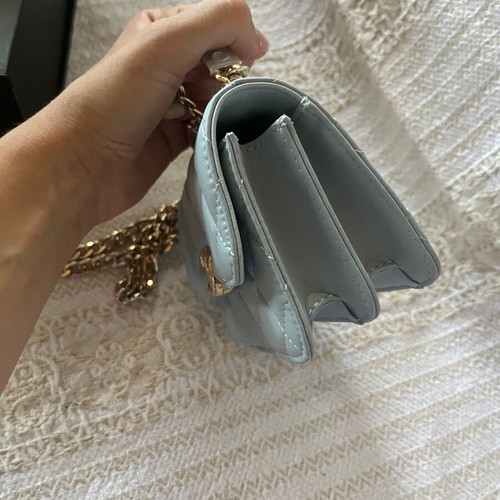 Leather baby blue handbag like new with gold chain and full packaging