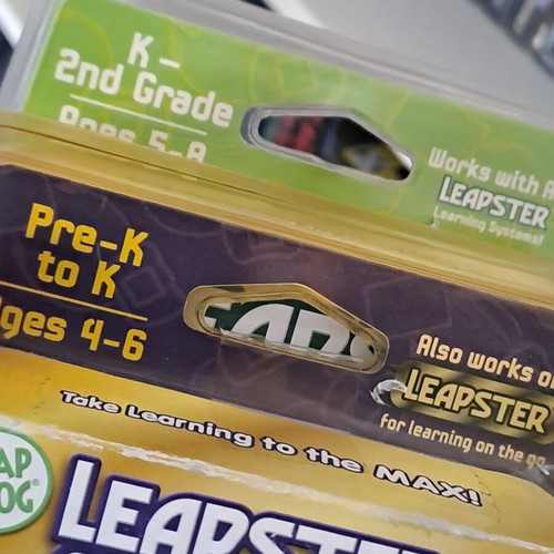 Leapster L-MAX learning game system with 2 sealed games Nascar and Letters on the Loose