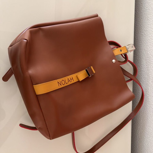 Nolah Backpack like new, brown with yellow strap