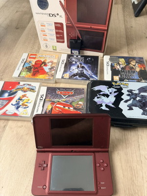 Nintendo DSi XL console like new with Action Replay, games, and case