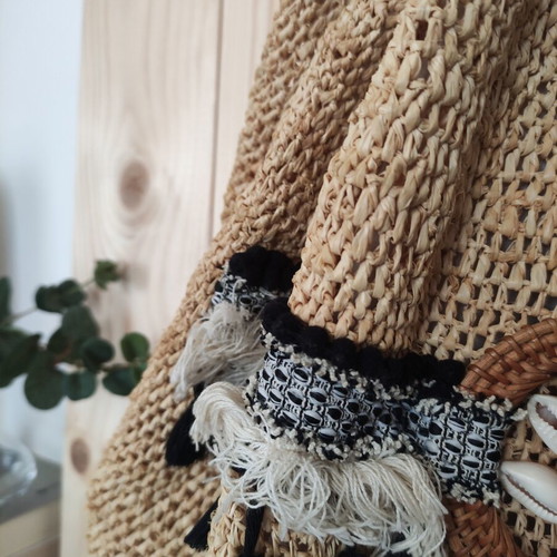 Boho straw backpack used with shells and rope straps, resort style