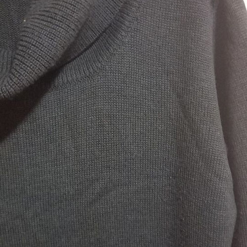 Long knitted gray dress used with loose neckline and decorative holes