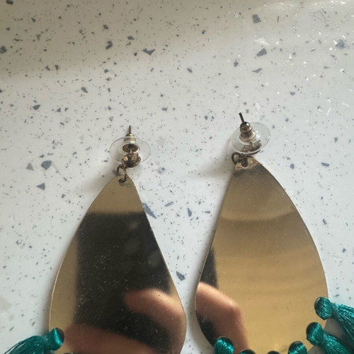 Dangling earrings used, gold-colored