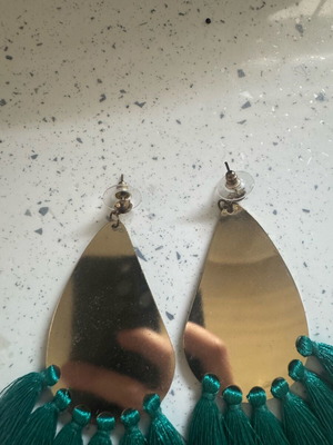 Dangling earrings used, gold-colored