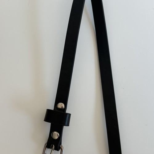 Black slim belt with silver buckle and studs, minimal style