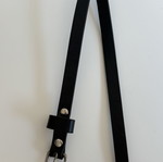 Black slim belt with silver buckle and studs, minimal style