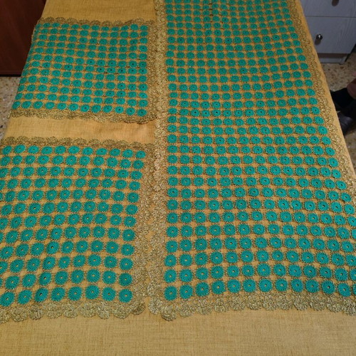 Table runner with two crocheted napkins and gold thread