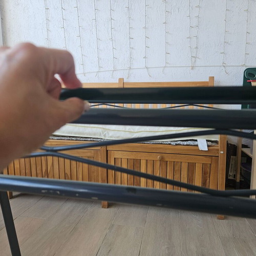 Garden table used with wooden legs, metal base and glass top