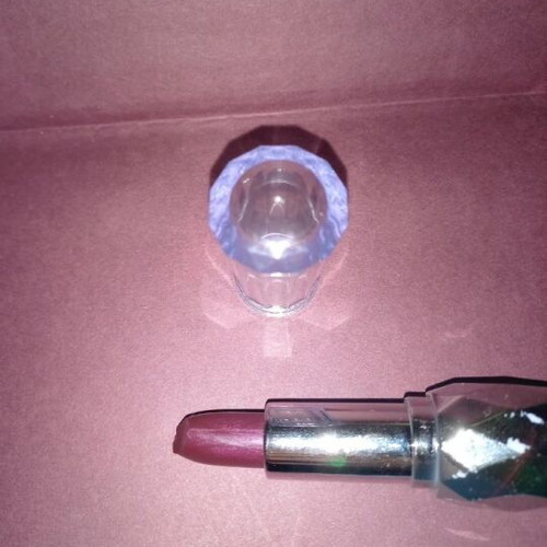 Purple lipstick shiny new with subtle glitter