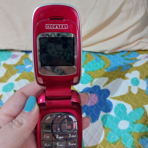 Alcatel vintage flip phone used, red, charger included