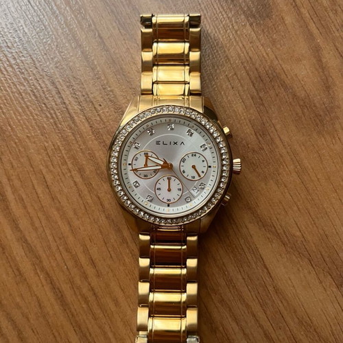 Elixa women's watch like new, gold bracelet with crystals