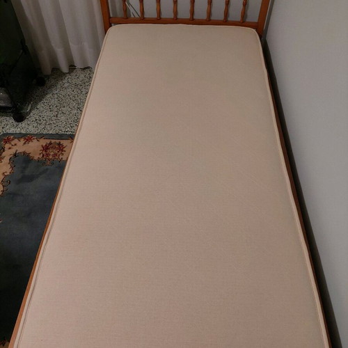 Single solid wood bed used with new mattress