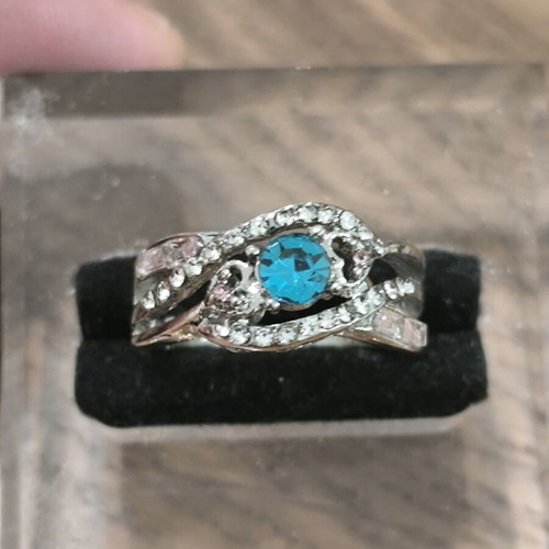 Silver vintage ring with blue zircon and white stones