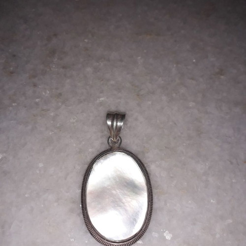 Silver pendant used with hallmark