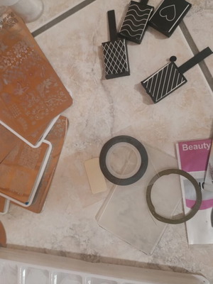 Nail art kit with tips, stamping plates and accessories
