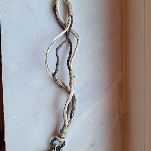 Necklace like new with woven cords, wooden cross, metal cross, and turquoise stone