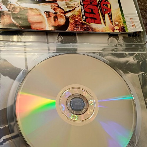 TNA Impact Xbox 360 game used with bonus DVD and collectible double-sided cover