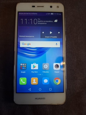 Huawei mobile phone used, white, with headphones and charger
