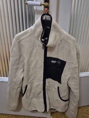 Cardigan used size M with faded logo