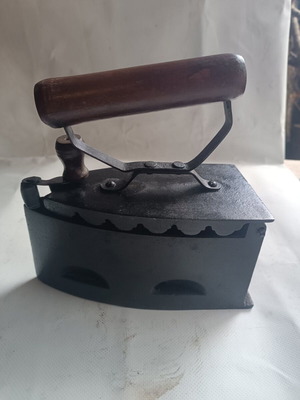 Charcoal iron in excellent condition, 50+ years old, with wooden handle