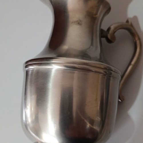 Vintage metal pitcher used with hinged lid and embossed handle