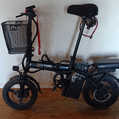 Electric bike used, 14 inches, front suspension, basket, disc brakes