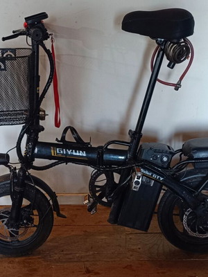 Electric bike used, 14 inches, front suspension, basket, disc brakes