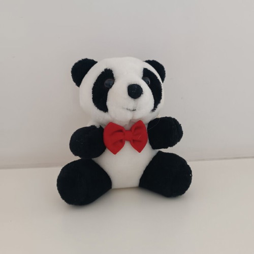 Plush panda with red bow tie