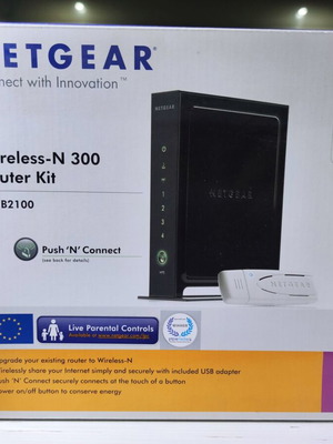 Netgear Wireless N300 Modem Router Kit like new with USB stick