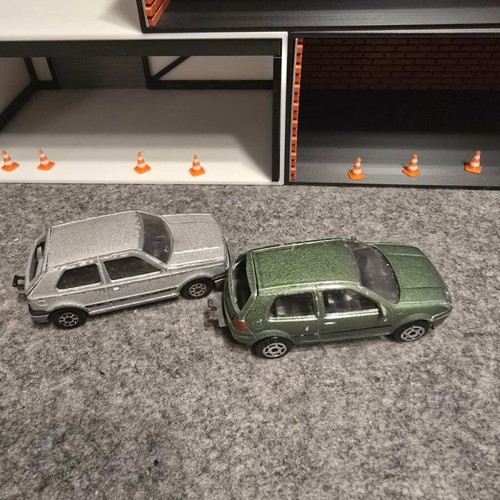 Golf 1/56 and Golf IV GTI 1/57 used, set of 2 toy cars