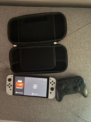 Nintendo Switch OLED white with Pro controller, 128GB SD card and carrying case