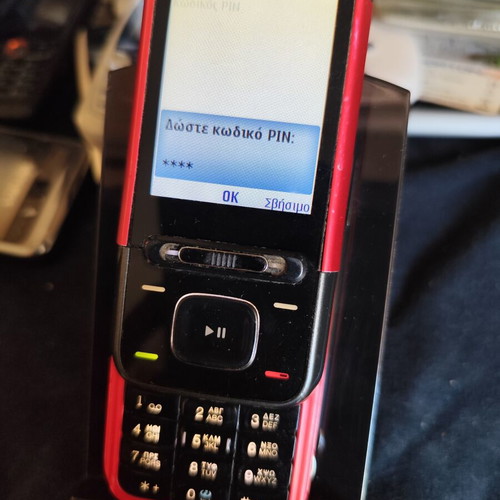 Nokia 5610 XpressMusic phone used with charger