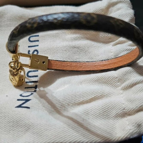 Louis Vuitton leather bracelet with gold plated backpack charm
