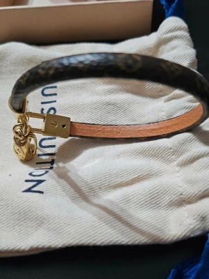 Louis Vuitton leather bracelet with gold plated backpack charm