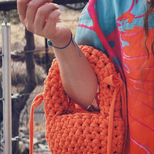 Handmade knitted mini bag vibrant orange with bows