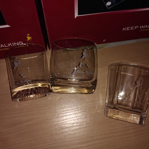 Johnnie Walker collectible set new with chess, whiskey glasses, and metal box
