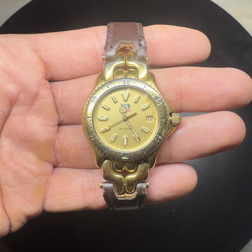 Tag Heuer gold watch used, functional needs battery