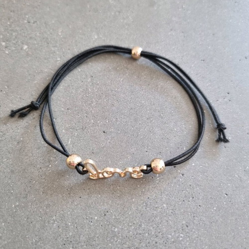 Love bracelet new with adjustable black and gold elastic