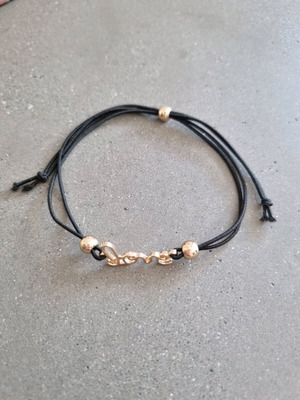 Love bracelet new with adjustable black and gold elastic