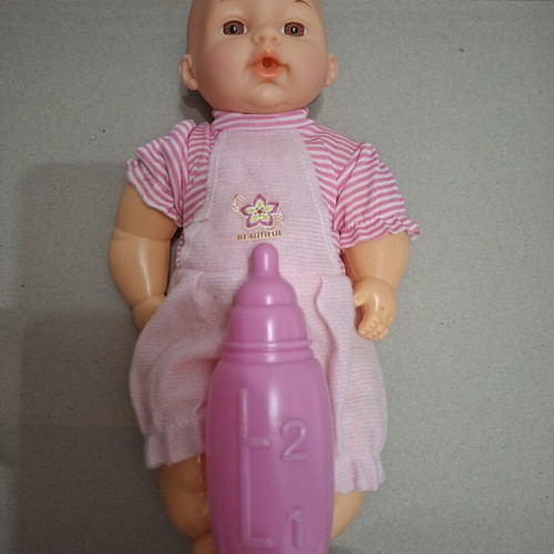 Baby doll with pacifier like new