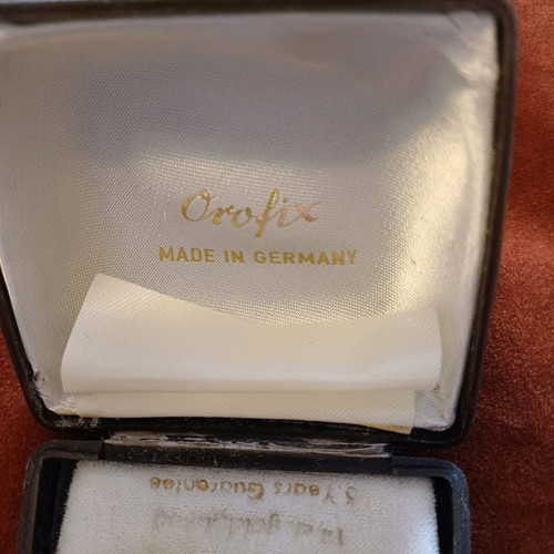 Orofix cufflinks used, vintage, embossed gold on coral background