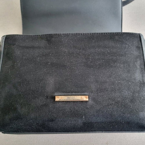 Carpisa black crossbody bag used with magnetic clasp